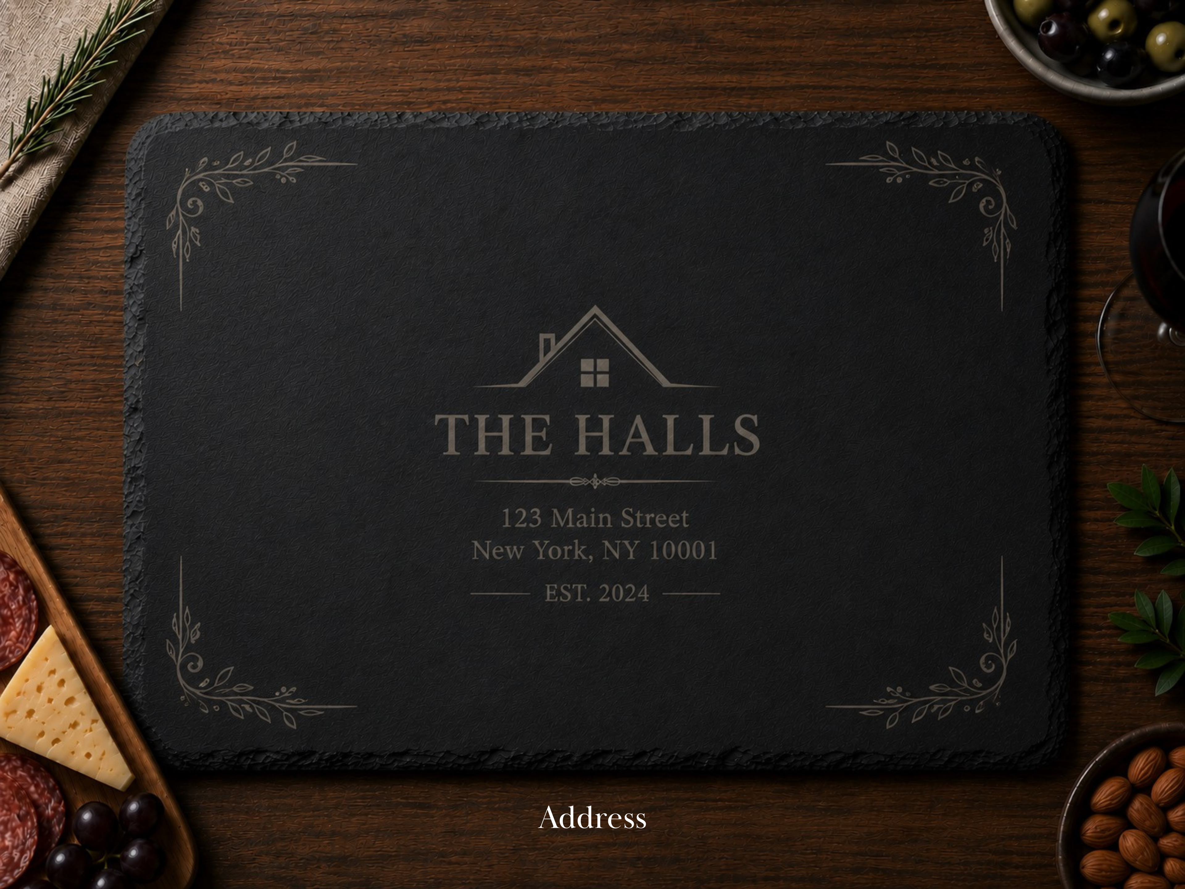 Slate cutting board with engraved text on a wooden surface