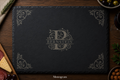 Black slate cutting board with 'Bernstein' monogram on a wooden surface with food items.